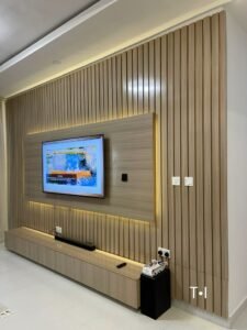 Fluted panels behind TV wall design